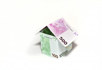 House made from euro bills on white background