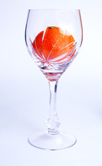 Tangerine in wine glass