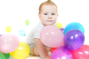 Fototapeta na wymiar cute baby with colorful balloons over white