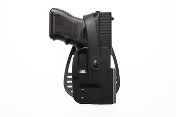 A pistol in a hard case holster