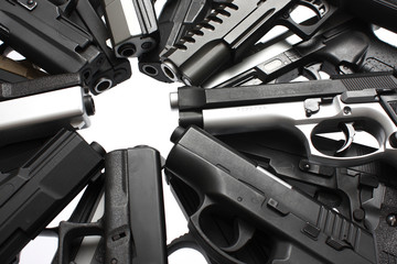 An assortment of pistols on a table