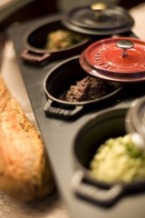 Cast iron pots with savory dipping sauces
