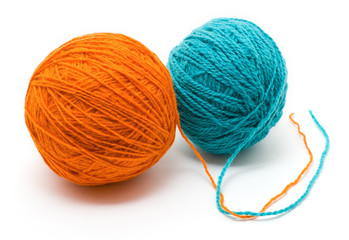 two coil with woolen threads of different colors