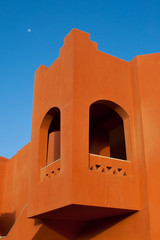Brown house. Blue sky with moon