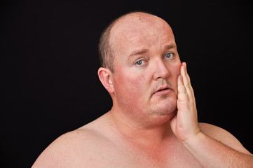 Obraz premium male in his 30's overweight on black background