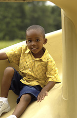 African American boy on slide