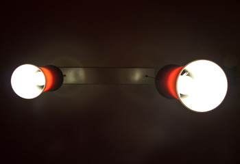 Two red interior lamps in the dark