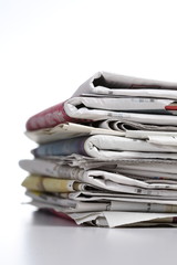 pile o f newspaper with white background