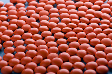 Red Tablet on blue closeup