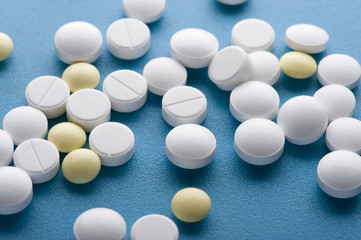 Medical tablet on blue background