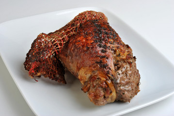 grilled organic stuffed turkey leg on a plate