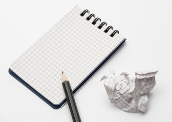 notebook with black pencil