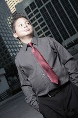 Fototapeta na wymiar Young boy in business attire glancing sideways