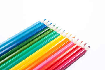 Colored pencils in a row