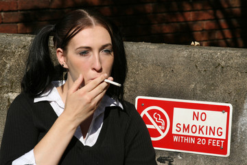 Schoolgirl smoking cigarette