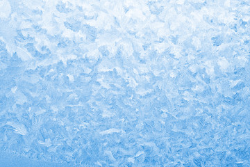 Light blue frozen window glass