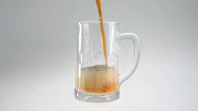 Beer pour in glass beer mug