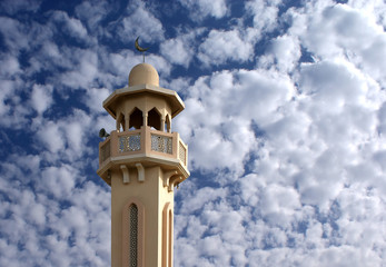 A minaret in fluffy sky