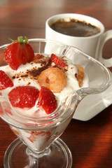 Yogurt dessert with fruits and coffee