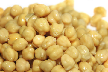 a handful of chickpeas on a white bacground