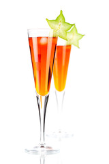 Orange alcohol cocktail with carambola