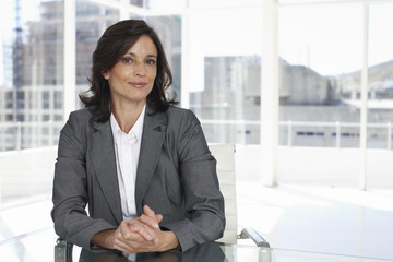 Businesswoman with contructions in the background