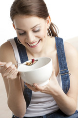 portrait of woman eating cereals