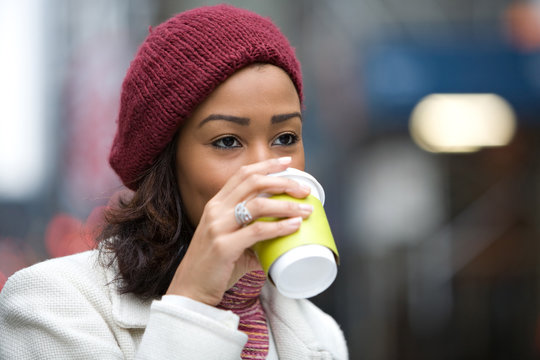 Woman Drinking a Hot Beverage