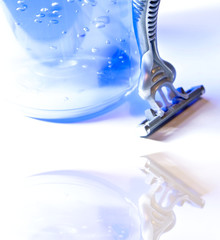 Shaving, modern razor and blue gel