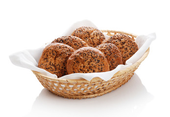 Buns with sesame in a woven basket