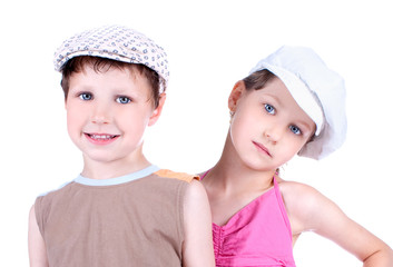 Cute blue-eyed children with whit caps