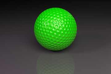 Green golfball on gray slightly reflective background