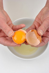 open one organic egg to separate egg yolk