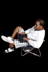 A young man using a laptop computer