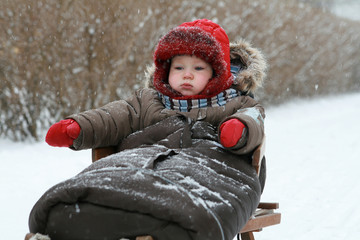 Winter baby on sled