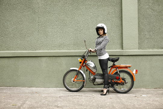 Sexy woman on a moped.