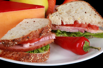 Close up of a ham sandwich on multigrain bread