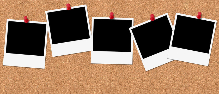 five polaroids with red pin on cork