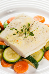 Boiled fish fillet with vegetables