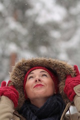 Young woman in fur hood in winter