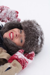 Woman laying on the snow