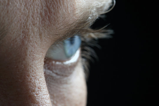 profile of blur male blue eye