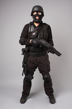 SWAT police officer with shotgun.