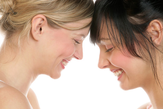 Close-up portrait of two women laughing