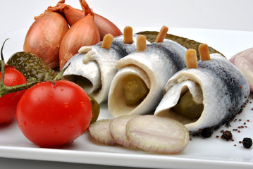 some fresh organic rollmops with tomato and onion