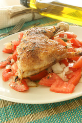 roasted delicious chicken with some organic tomato