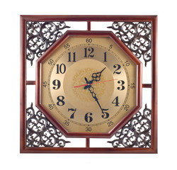 Antique wall clock with carved wooden frame