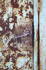 an old metal door with handle