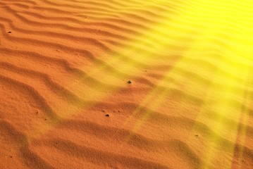 red sand in a rays of sun