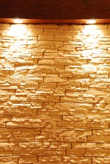 Unshaped stone wall with spot lights